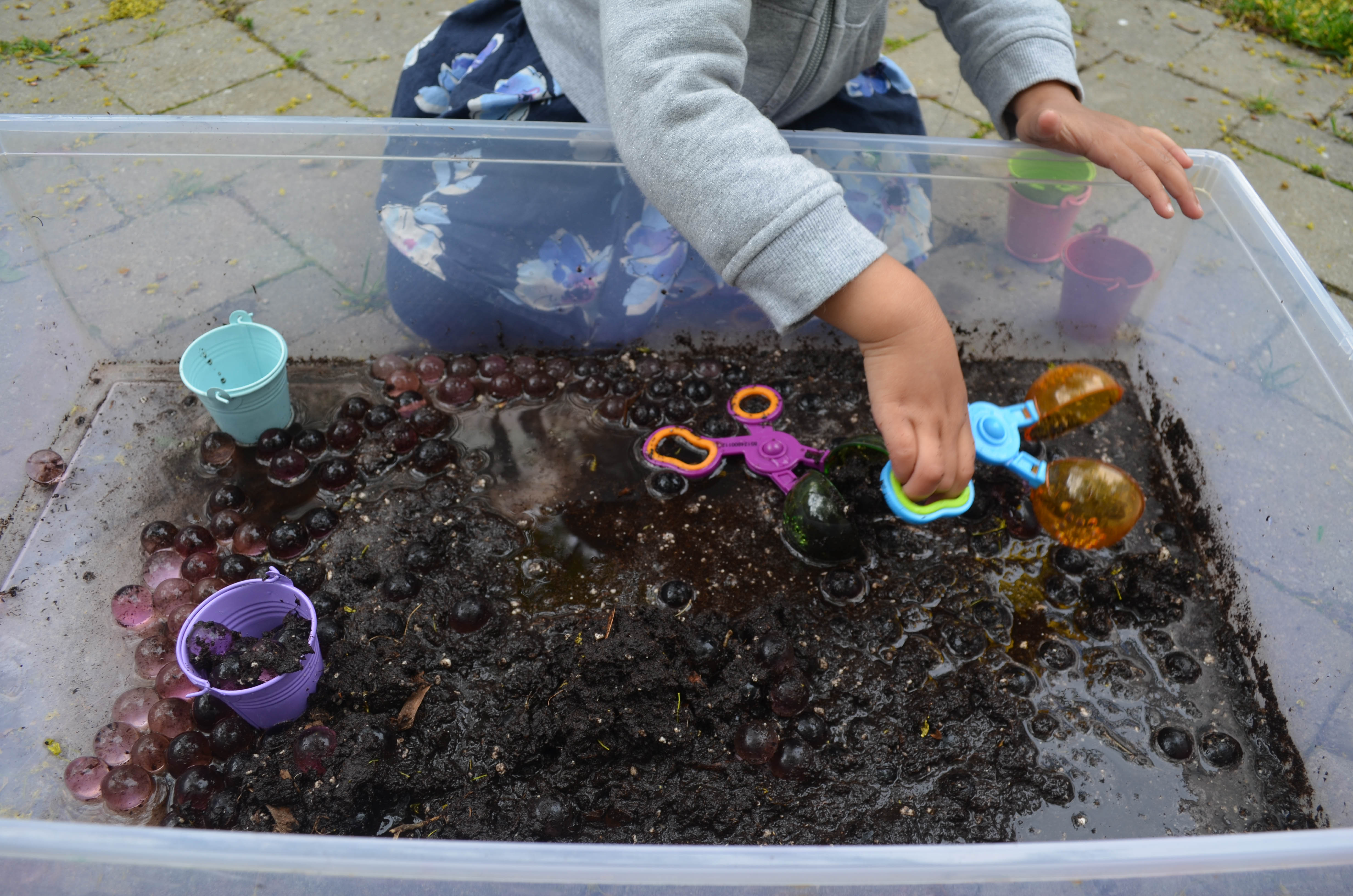 Water beads in mud for toddlers