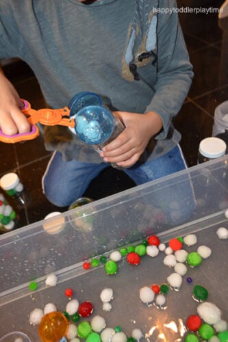 Christmas Pom Pom Sensory Bin - Happy Toddler Playtime