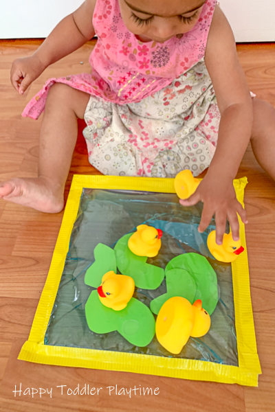 Pretend play activity with rubber ducks for toddlers