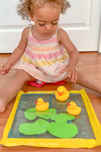 Pretend play sensory bag activity with rubber ducks for toddlers