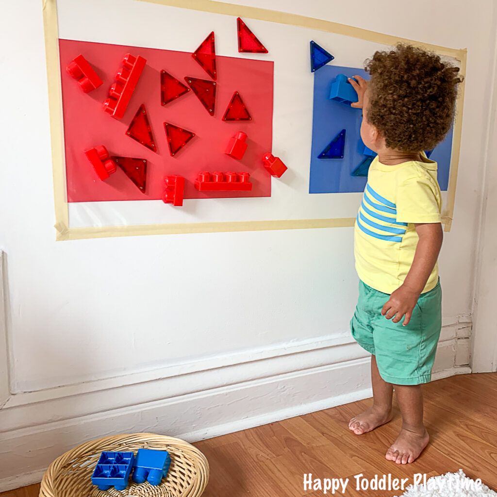 a fun contact paper sticky wall activity for toddlers and preschoolers