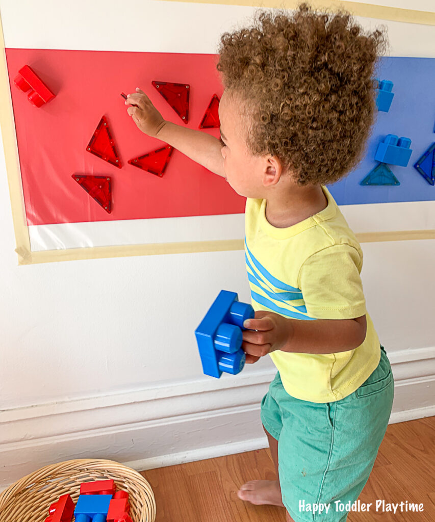 a fun contact paper sticky wall activity for toddlers and preschoolers