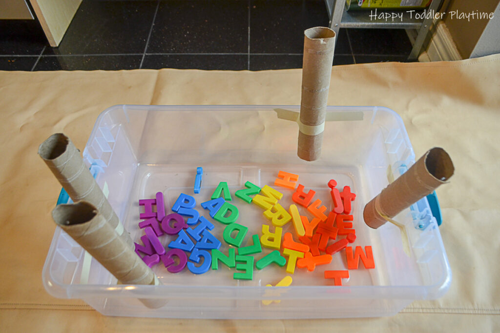 Alphabet drop is a toddler literacy and fine motor activity