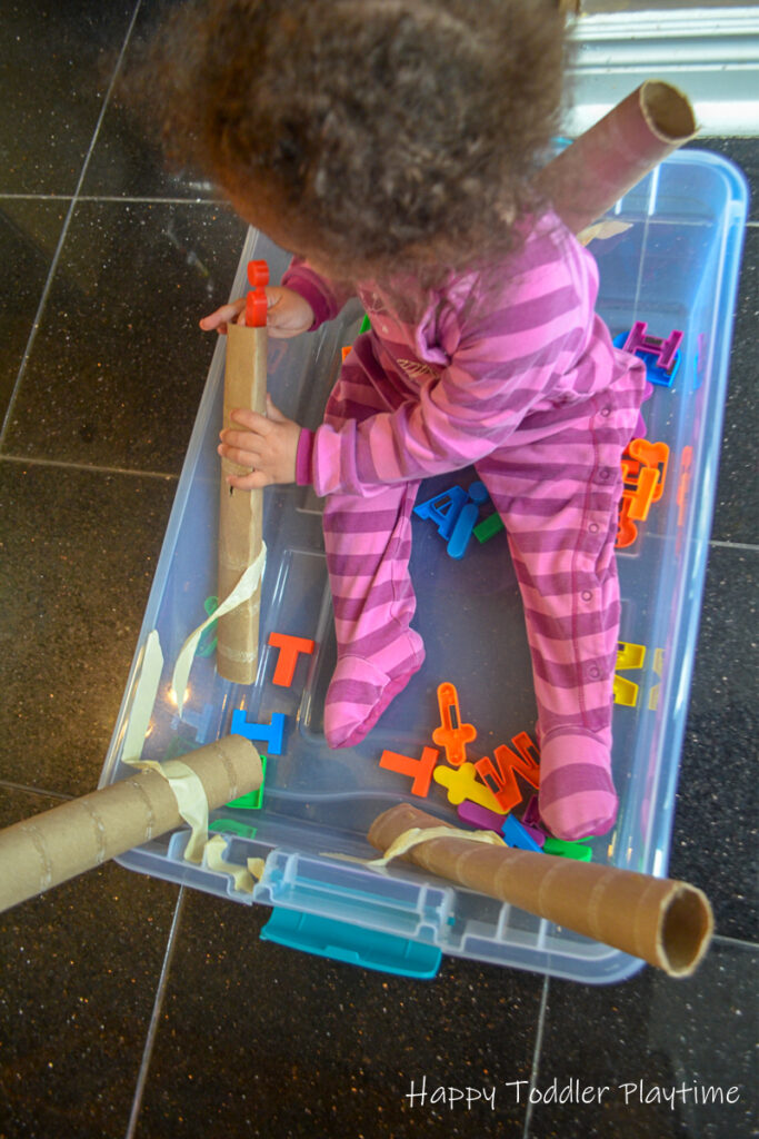 Alphabet drop is a toddler literacy and fine motor activity
