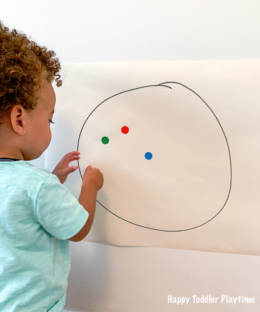 Fine motor game using dot stickers for toddlers