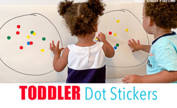 toddlers playing with dot stickers for a fine motor activity
