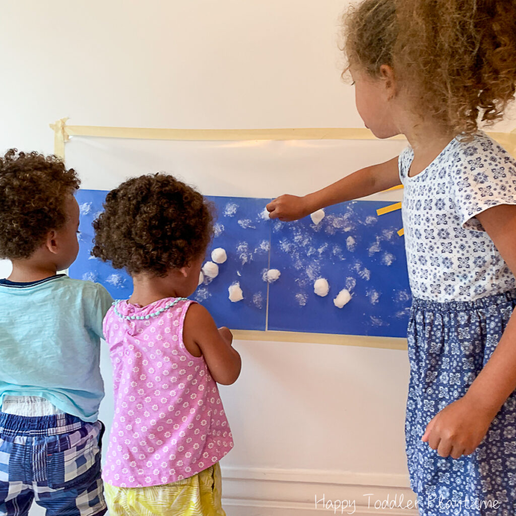 cloudy day sticky wall activity for toddlers using contact paper