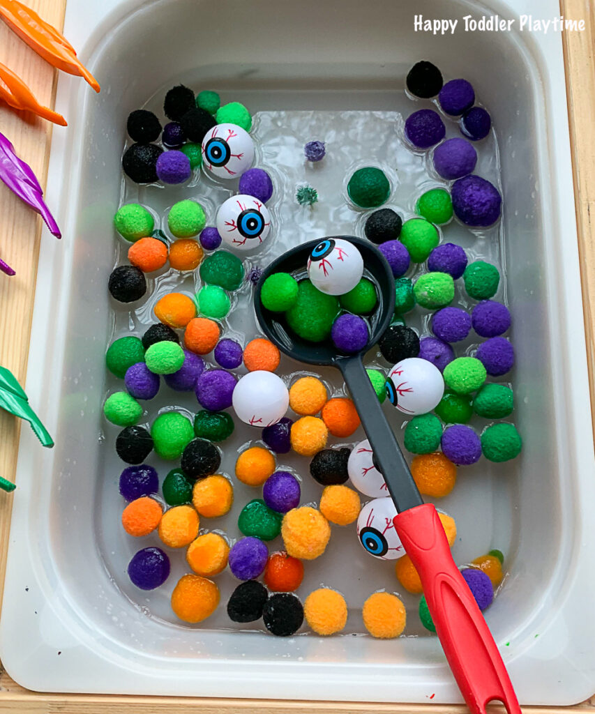 Eyeball and Pom Pom Halloween Sensory soup for toddlers and preschoolers