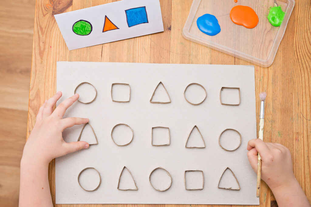 Practice learning shapes with this fun paint the shapes activity for preschoolers and kindergartners. This easy activity is a great hands-on early math activity for developing familiarity with geometric shapes.