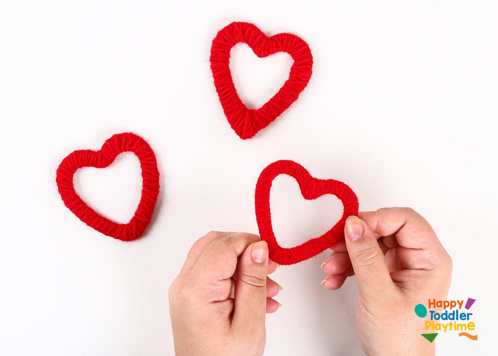 Yarn Wrapped Hearts Craft – Valentines Day Crafts - Happy Toddler Playtime